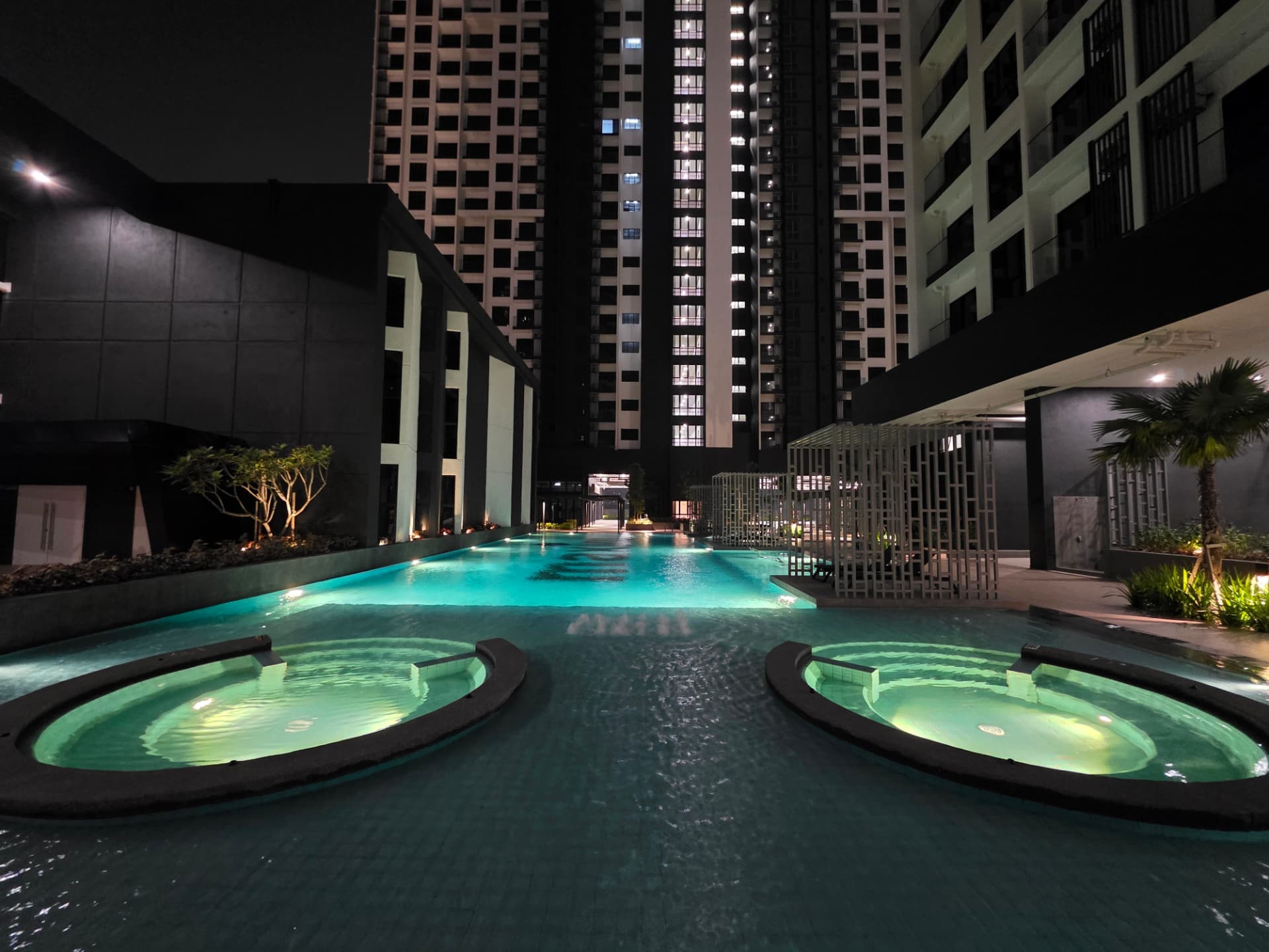 Maxim Risen — resort-style pool and facilities at night