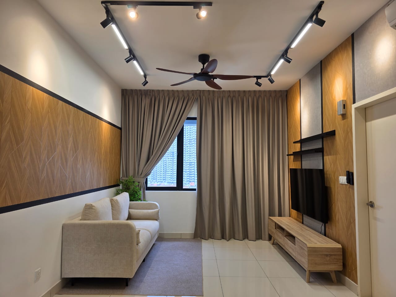 Pudu residence — warm timber feature wall and layered lighting