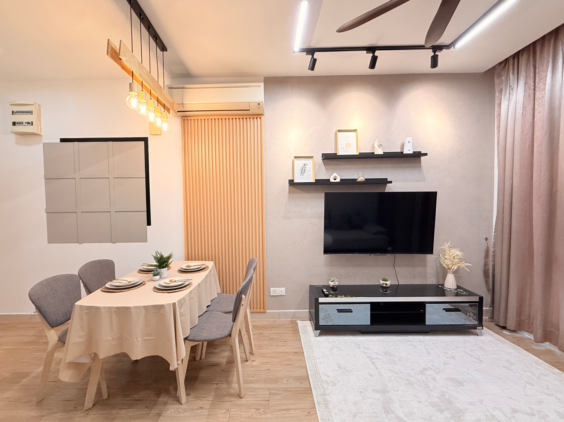 Maluri co-living residence — warm timber feature wall and layered lighting